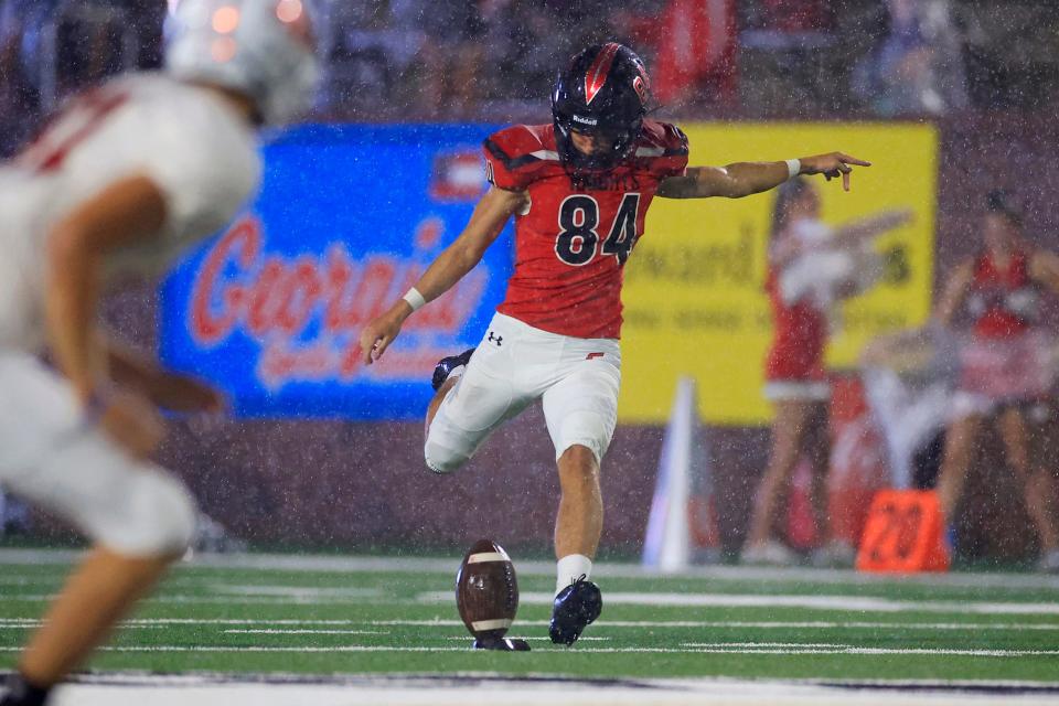 Creekside's Ronald Daragjati (84) kicks off the ball during the first quarter of the inaugural Border Classic football game Thursday, Sept. 8, 2022 at Glynn County Stadium in Brunswick, Ga.