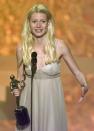 Actress Gwyneth Paltrow accepts the award for "Outstanding Performance by a Female Actor in a Leading Role" for her performance in "Shakespeare in Love" during the Fifth Annual Screen Actors Guild Award show at the Shrine Auditorium in Los Angeles, Sunday, March 7, 1999. (AP Photo/ Michael Caufield)