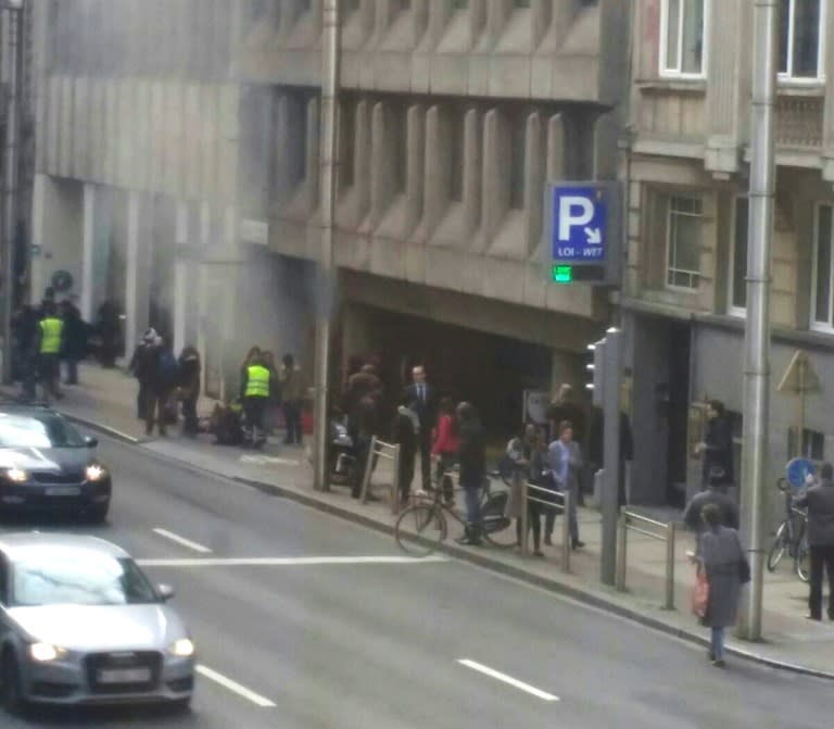 Smoke rises from the Maalbeek metro station in Brussels following a blast at the station close to the capital's European quarter on March 22, 2016