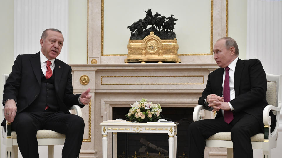 Turkey's President Recep Tayyip Erdogan, left, speaks to Russian President Vladimir Putin during their talks in the Kremlin in Moscow, Russia, Wednesday, Jan. 23, 2019. (Alexander Nemenov/Pool Photo via AP)