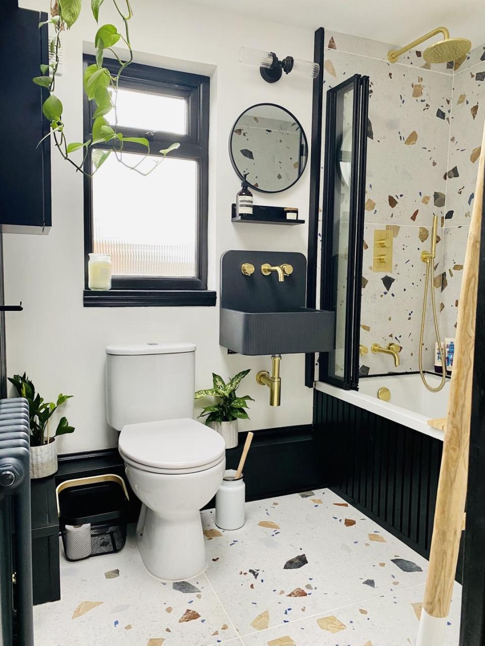 a bathroom with a toilet and a mirror