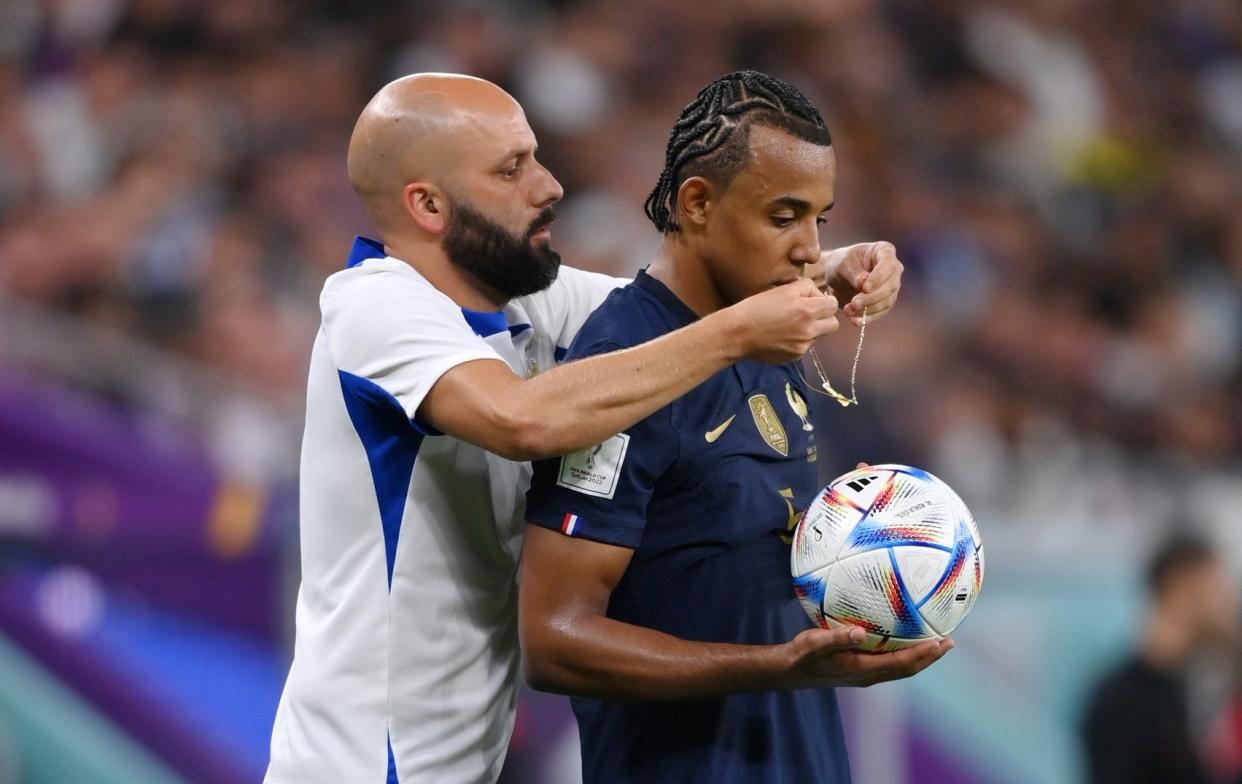 Jules Kounde of France/'A little taste of Sunday league': France's Jules Kounde has to remove necklace during Poland match - GETTY IMAGES