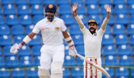 Cricket - Sri Lanka v India - Third Test Match - Pallekele, Sri Lanka - August 14, 2017 - India's captain Virat Kohli celebrates the wicket of Sri Lanka's Kusal Mendis. REUTERS/Dinuka Liyanawatte/Files