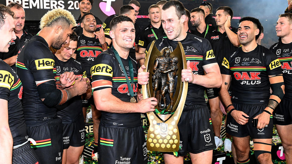 Nathan Cleary and Isaah Yeo, pictured here with the Premiership Trophy after winning the 2021 NRL grand final.