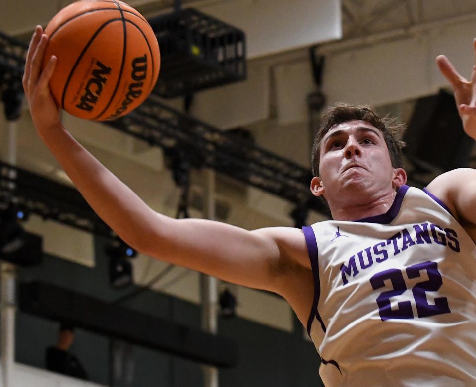 Wesleyan Christian School's senior Ty Cloud scores during basketball action earlier in the season. The Mustangs season came to an end with a playoff loss this weekend.