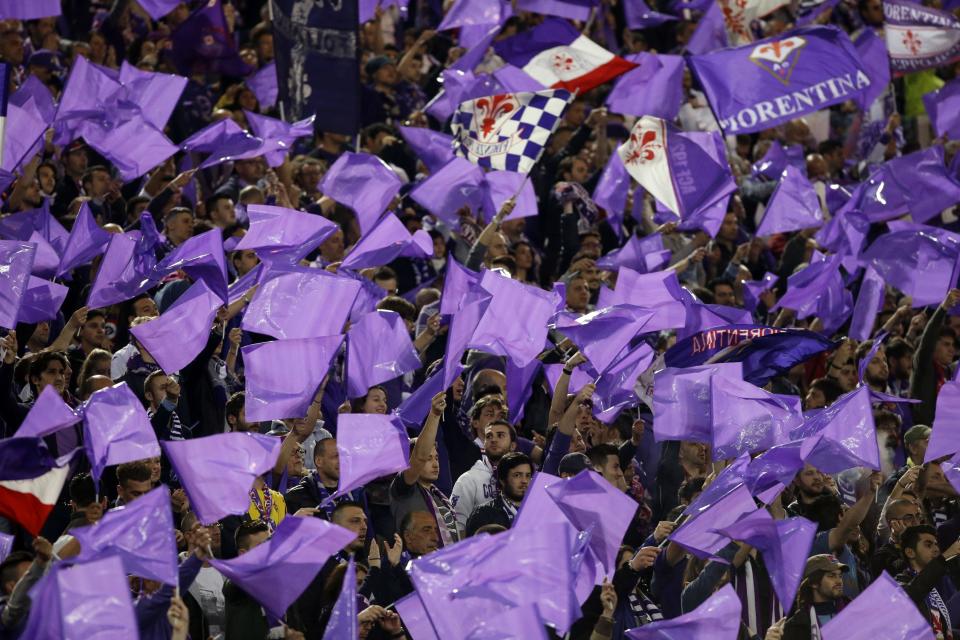 Fiorentina fans wave flags prior to the start of Italian Cup final match between Fiorentina and Napoli in Rome's Olympic stadium Saturday, May 3, 2014. (AP Photo/Gregorio Borgia, Pool)