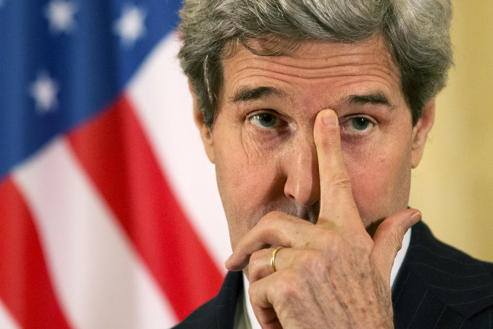 In this March 30, 2014, photo, U.S. Secretary of State John Kerry rubs his eye while listening to a question during a news conference at the U.S. Ambassador to France's residence in Paris, after he met with Russian Foreign Minister Sergey Lavrov about the situation in Ukraine. The current trip was to have been a five-day trip to Europe and Saudi Arabia, but with crisis on multiple fronts and Kerry’s decision on how to proceed turned a routine trip abroad into a frenetic tour of high-stakes diplomacy marked by abrupt changes in plan that have come to define his 14-month tenure as secretary of state. (AP Photo/Jacquelyn Martin, Pool)