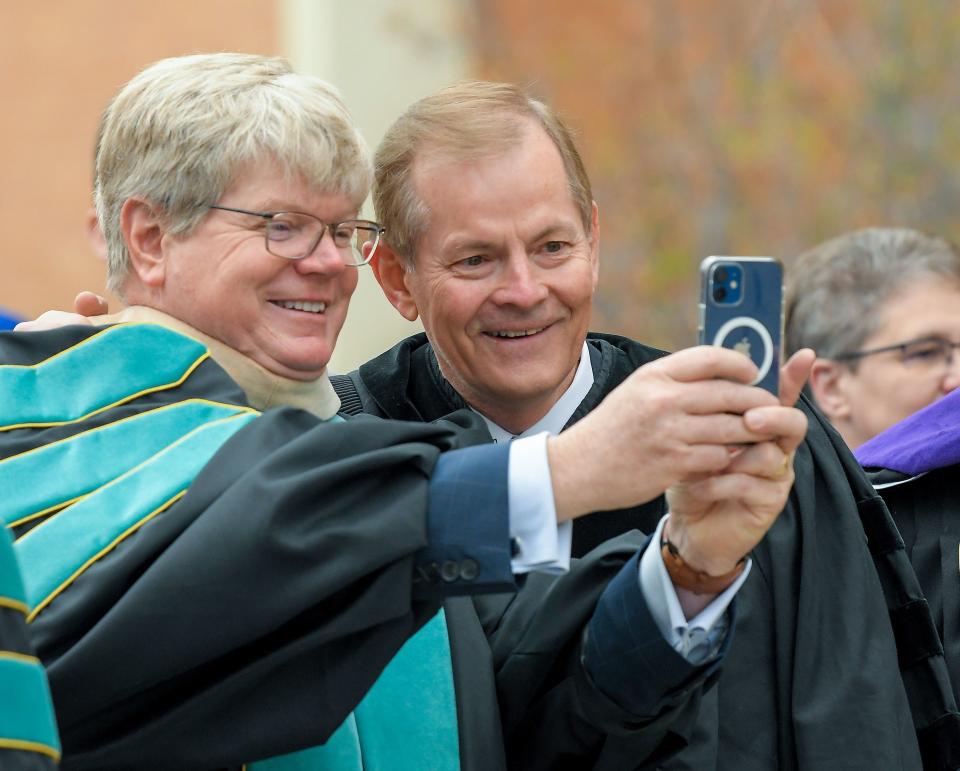 Arthur E. Newell, of the Utah Board of Higher Education, takes a photo with Elder Gary E. Stevenson during Utah State University’s commencement ceremony on Thursday, May 4, 2023, in Logan, Utah. | Eli Lucero, Herald Journal