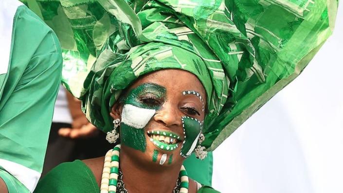 A Nigeria nsupporter cheers before the Group D Africa Cup of Nations (CAN) 2021 football match between Nigeria and Egypt at Stade Roumde Adjia in Garoua on January 11, 2022