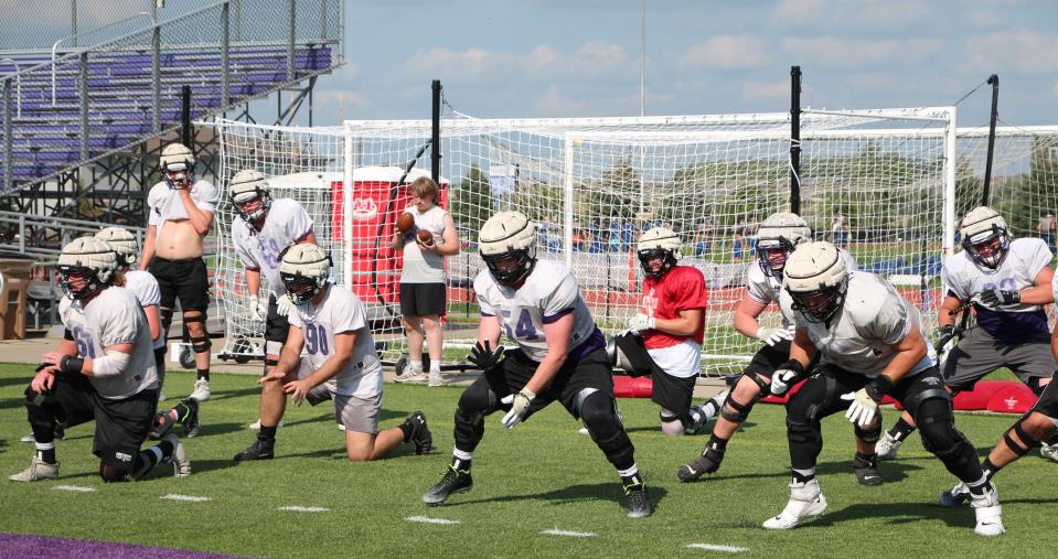 USF offensive linemen work through a drill at a recent practice at Bob Young Field.