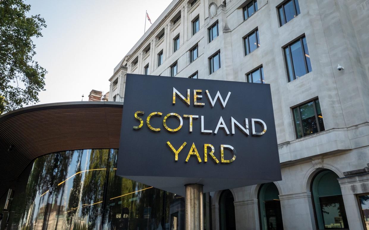 The New Scotland Yard name sign outside the headquarters of the Metropolitan Police.