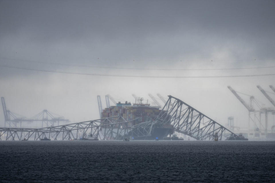 The container ship Dali, rests against wreckage of the Francis Scott Key Bridge as seen from Pasadena, Md. (Alex Brandon / AP)