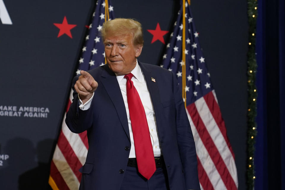 Former President Donald Trump greets supporters as he arrives at a commit to caucus rally, Tuesday, Dec. 19, 2023, in Waterloo, Iowa. (AP Photo/Charlie Neibergall)