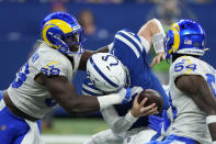 Indianapolis Colts quarterback Carson Wentz (2) is sacked by Los Angeles Rams' Sebastian Joseph-Day during the second half of an NFL football game, Sunday, Sept. 19, 2021, in Indianapolis. (AP Photo/AJ Mast)