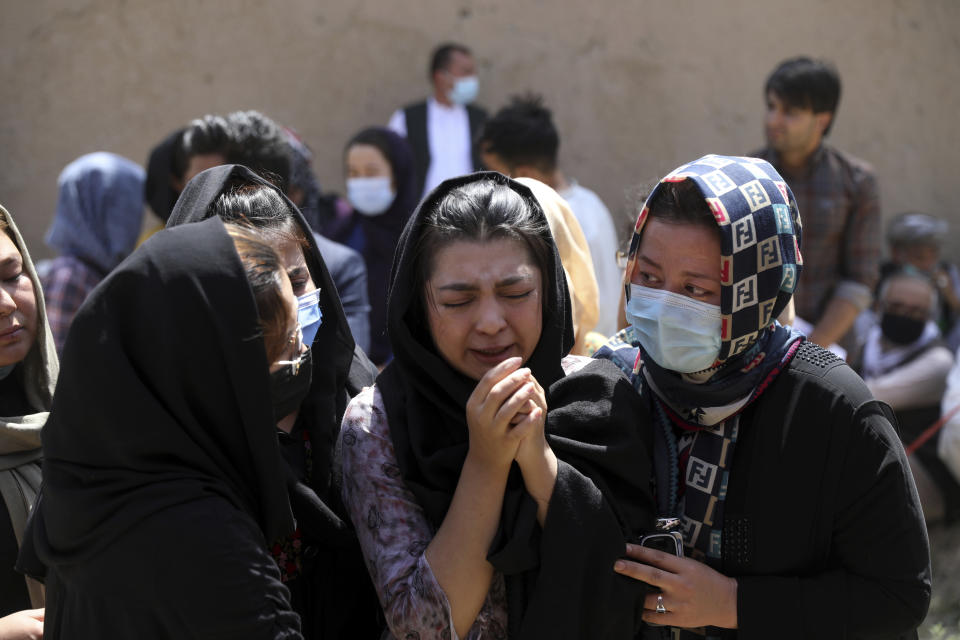 Afghan Hazaras attend the funeral of Mina Khiari, who was killed in bombing last week, in Kabul, Afghanistan, Saturday, June 5, 2021. After the collapse of the Taliban 20 years ago, Afghanistan's ethnic Hazaras began to flourish and soon advanced in various fields, including education and sports, and moved up the ladder of success. They now fear those gains will be lost to chaos and war after the final withdrawal of American and NATO troops from Afghanistan this summer. (AP Photo/Rahmat Gul)