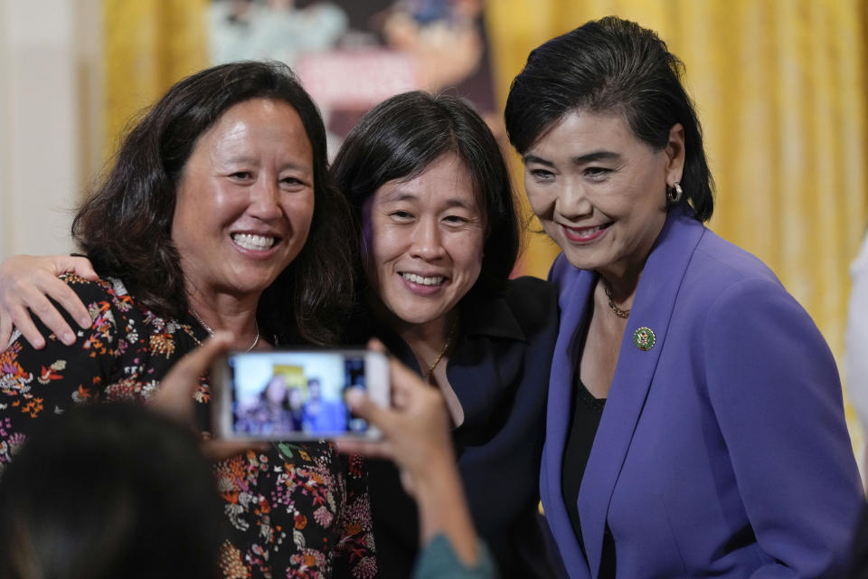 From left, Debbie Ho, founder of Mapetsi Policy Group, U.S. Trade Representative Katherine Tai and Rep. Judy Chu, D-Calif., pose for a photo as they arrive for a screening of the series "American Born Chinese" in the East Room of the White House in Washington on Monday, May 8, 2023. The screening is being held in celebration of Asian American, Native Hawaiian, and Pacific Islander Heritage Month. (AP Photo/Susan Walsh)