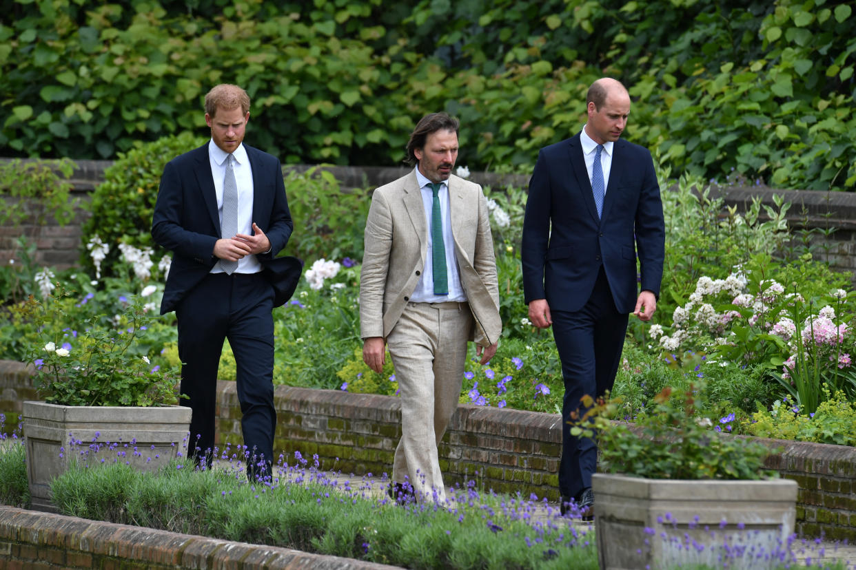 The brothers and garden designer Pip Morrison walk through the newly designed garden. (Photo: PA Images)
