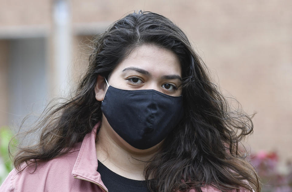 Kristina Negron poses for a photograph Tuesday, Sept. 29, 2020, in Schenectady, N.Y. Negron was laid off from her job as an aide for a special education class at Schenectady High School due to budget cuts. (AP Photo/Hans Pennink)