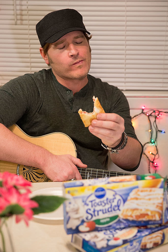 a man eating toster strudel