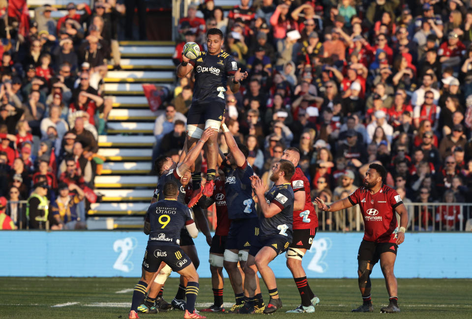 Highlanders Shannon Frizell is held aloft by his teammates as he wins a line out during the Super Rugby Aotearoa rugby game between the Crusaders and the Highlanders in Christchurch, New Zealand, Sunday, Aug. 9, 2020. (AP Photo/Mark Baker)