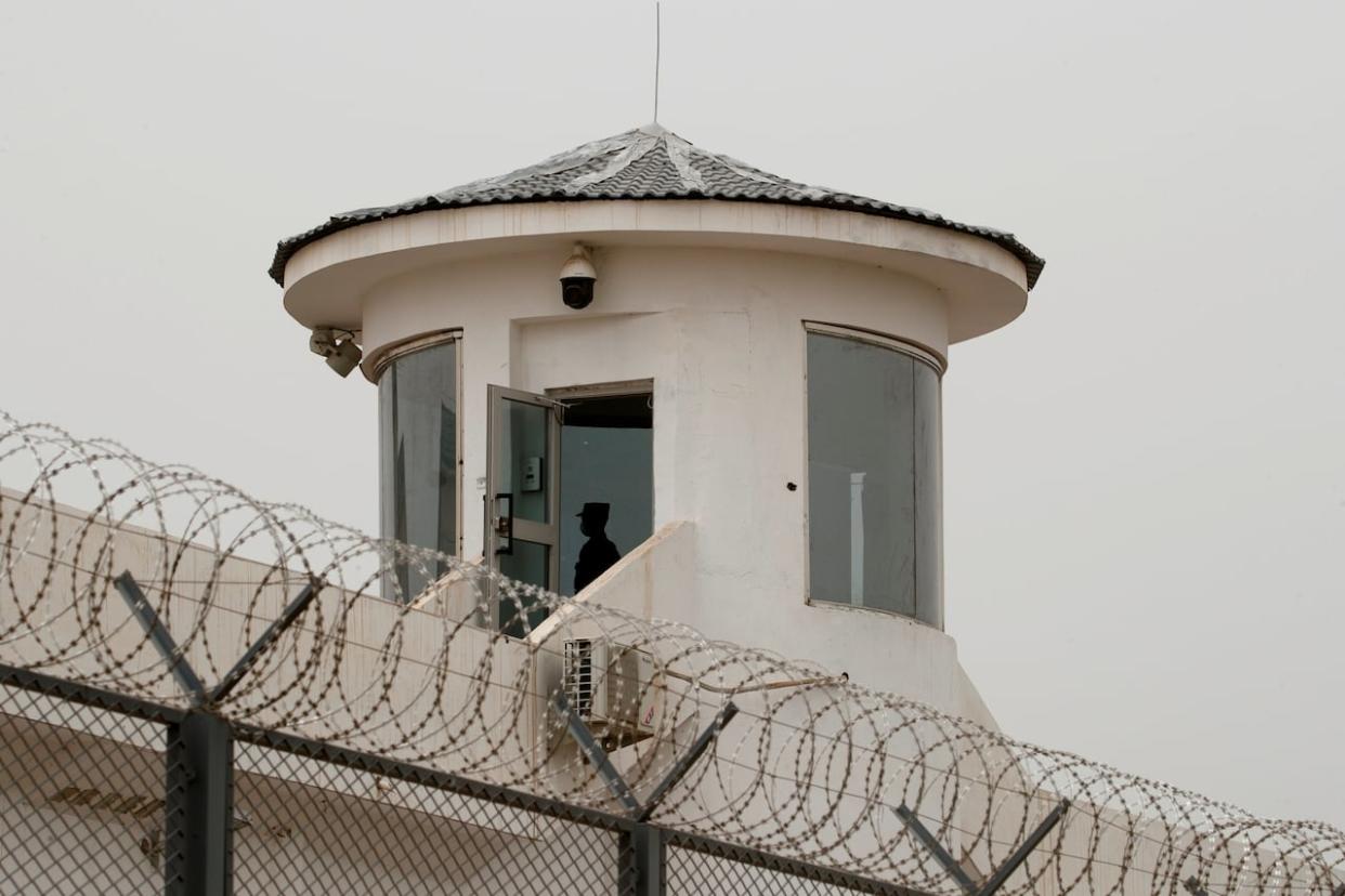 A guard stands in a watchtower of Kashgar prison in Kashgar, Xinjiang Uyghur Autonomous Region, China on May 3, 2021. (Thomas Peter/Reuters - image credit)