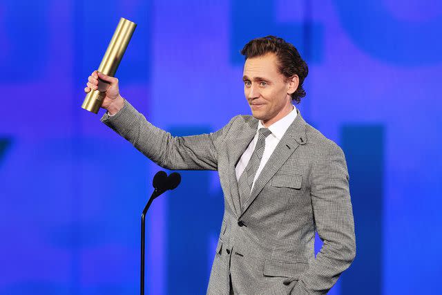 <p>Rich Polk/NBC</p> Tom Hiddleston accepts Sci-Fi/Fantasy Show of the Year for "Loki" at the 2024 People's Choice Awards.