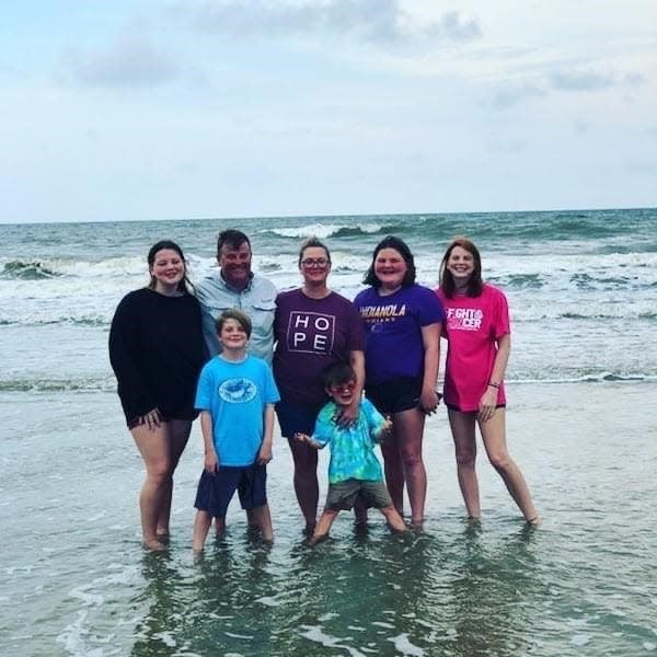 Andrea and John Carlson enjoy Caswell Beach, North Carolina, in 2020 with their five children. Left to right: Hannah, John, Andrea, Lilly and Brooklynn. Front row: Daniel and Joe.