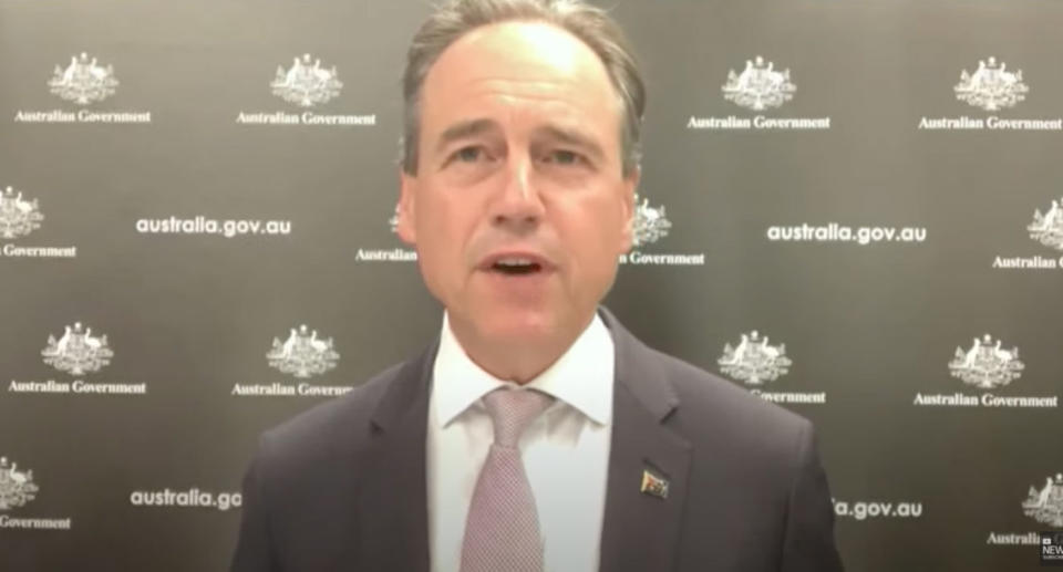 Greg Hunt announced the period to wait for a Covid booster vaccine would be reduced. Source: ABC News/YouTube