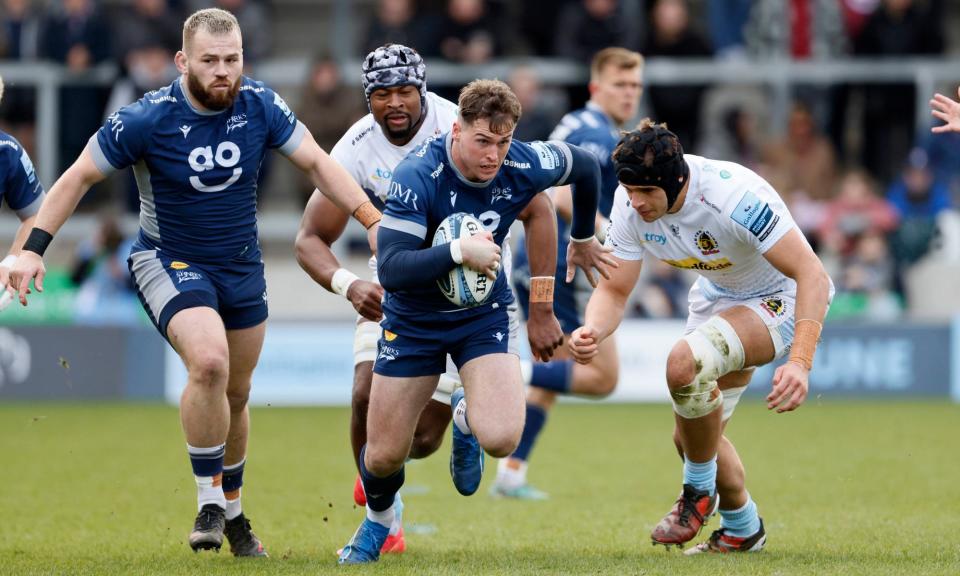 <span>Tom Roebuck breaks clear of the Exeter defence – his hat-trick performance has seen him promised a new pair of trainers by his director of rugby.</span><span>Photograph: Richard Sellers/PA</span>