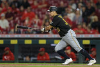 Pittsburgh Pirates' Yoshi Tsutsugo hits an RBI-single during the third inning of a baseball game against the Cincinnati Reds in Cincinnati, Monday, Sept. 20, 2021. (AP Photo/Aaron Doster)