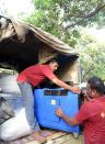 Personnel from India's National Disaster Response Force (NDRF) load a generator to a truck ready to be airlifted to Nepal, at a NDRF camp at Chiloda village some 40 km from Ahmedabad, on April 25, 2015