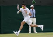 Milos Raonic of Canada hits a shot during his match against Nick Kyrgios of Australia at the Wimbledon Tennis Championships in London, July 3, 2015. REUTERS/Stefan Wermuth