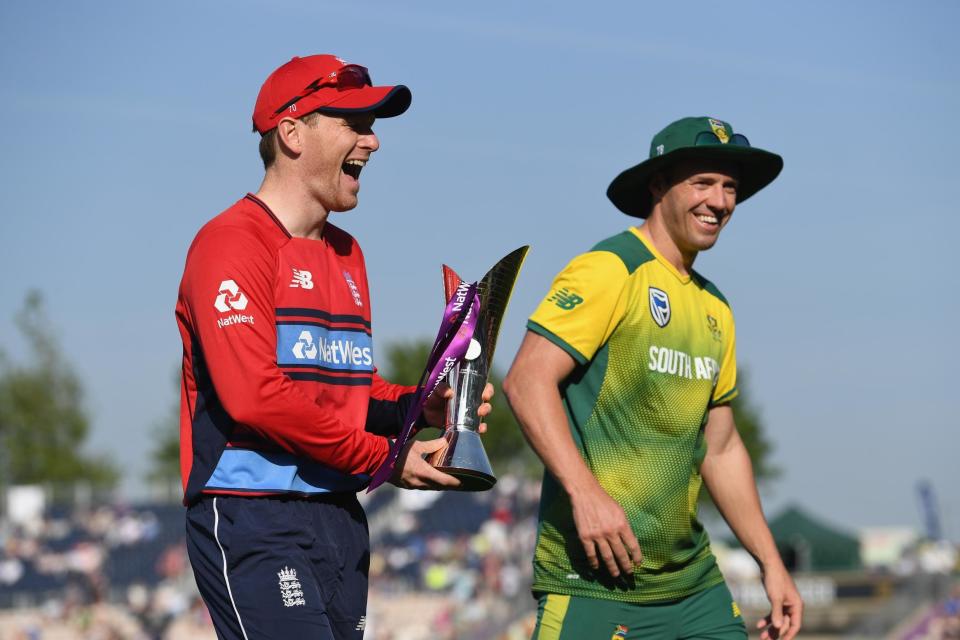 Morgan shares a joke with South Africa skipper AB de Villiers: Getty Images