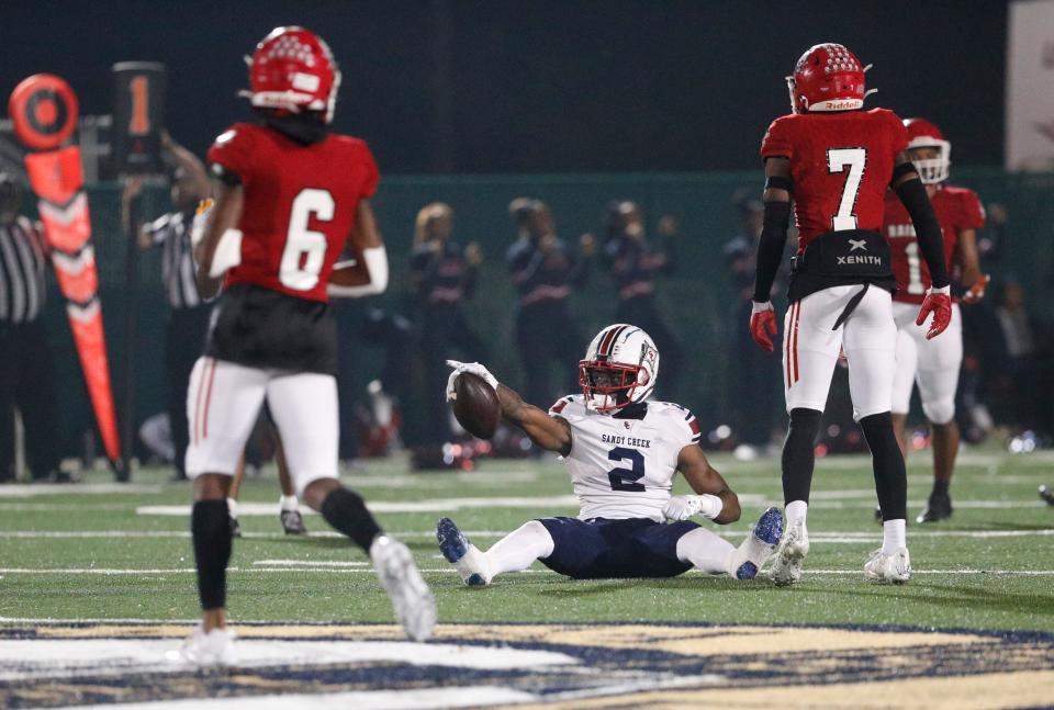 Sandy Creek's Kaleb Cost signals a first down after making an acrobatic catch during Friday's game against Savannah Christian at Pooler Stadium.