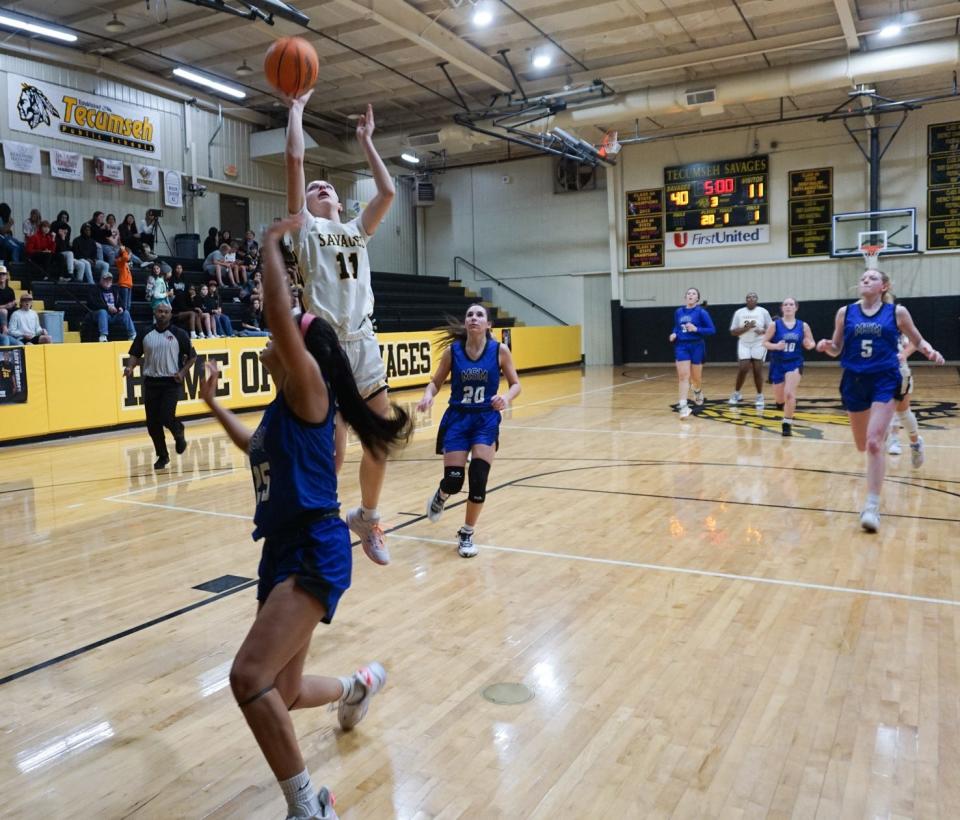 Junior Kenzli Warden (11) goes up for the shot against a Mount St. Mary defender on Tuesday night.