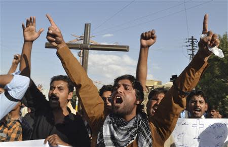 Christian men in Quetta shout anti-government slogans as they protest against a twin suicide bomb attack on a church in Peshawar, September 22, 2013. REUTERS/Naseer Ahmed