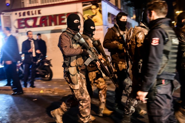 Turkish police patrol the streets after a car bomb exploded near the stadium of football club Besiktas in Istanbul on December 10, 2016