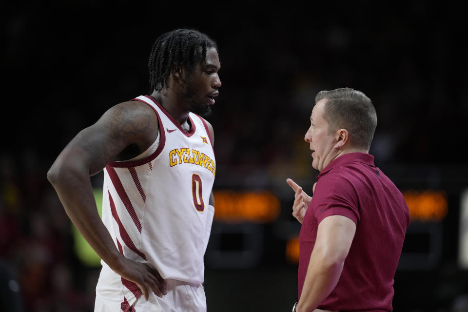Iowa State head coach T.J. Otzelberger talks with forward Tre King (0) during the first half of an NCAA college basketball game against BYU, Wednesday, March 6, 2024, in Ames, Iowa. (AP Photo/Matthew Putney)