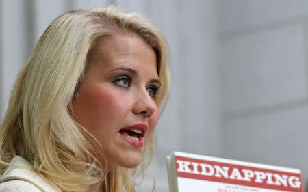 FILE PHOTO: Elizabeth Smart talks to the media outside the Federal Courthouse after addressing her kidnapper, Brian David Mitchell, during his sentencing in Salt Lake City, Utah, U.S., May 25, 2011. REUTERS/Michael Brandy/File Photo