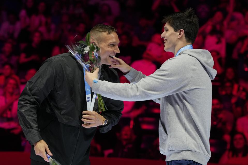 Caeleb Dressel and Thomas Heilman celebrate after the Men's 100 butterfly finals Saturday, June 22, 2024, at the US Swimming Olympic Trials in Indianapolis. (AP Photo/Michael Conroy)