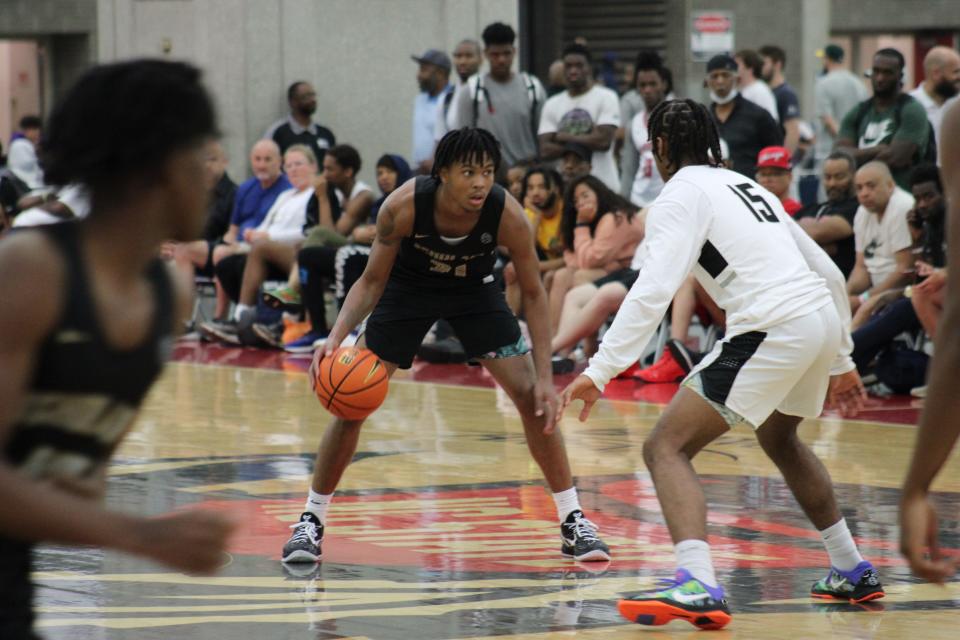 DJ Wagner of the NJ Scholars looks down the court during an AAU basketball game Sunday, May 29, 2022, at the Kentucky Exposition Center in Louisville, Ky. Wagner is one of the top recruits in the 2023 class and has scholarship offers from both Louisville and Kentucky.