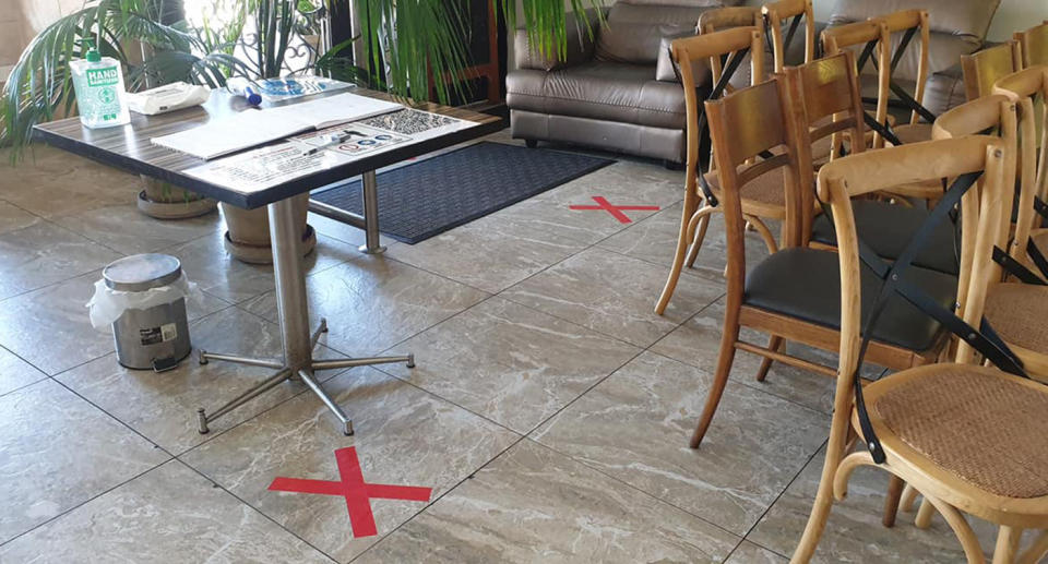 Social distancing markers appear on the floor of Jasmins1 Lebanese restaurant in Liverpool