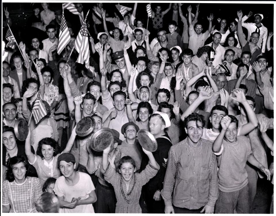 A jubilant crowd celebrates Japan's unofficial surrender on Aug. 14, 1945 outside Providence City Hall.