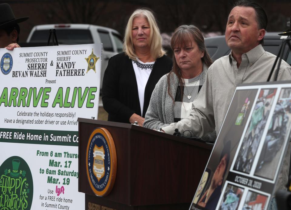 Summit County Prosecutor Sherri Bevan Walsh listens to Sandi and Scott Churby, talk about their late son Clintin at a press conference in March promoting Arrive Alive, a program that offers free rides for those who have too much to drink over holiday weekends. Churby, 27 was killed by a drunk driving the wrong way on the highway in October 2020.