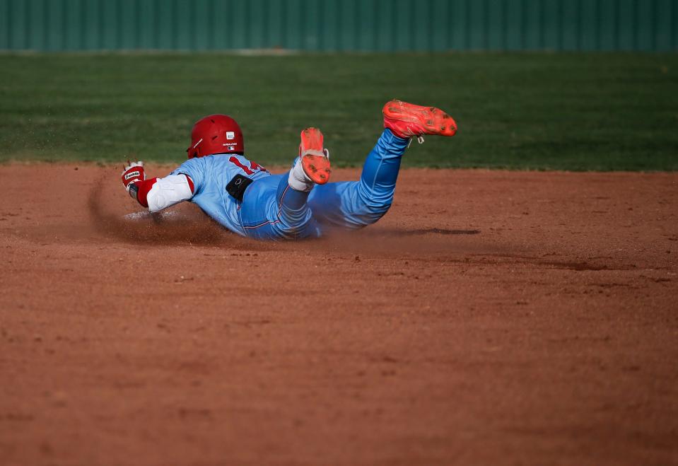 Glendale's Sebastian Norman slides safely into second as the Falcons take on the McDonald County Mustangs on Monday, March 20, 2023.