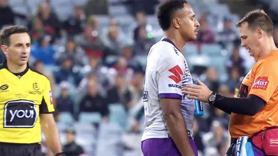 The Melbourne Storm trainer, pictured here checking on Felise Kaufusi.