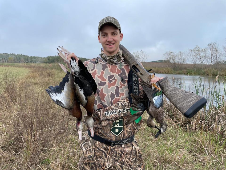 <em>Field & Stream</em> Senior Editor Ryan Chelius, with a pair of black-bellied whistling ducks and a pair of blue-winged teal.