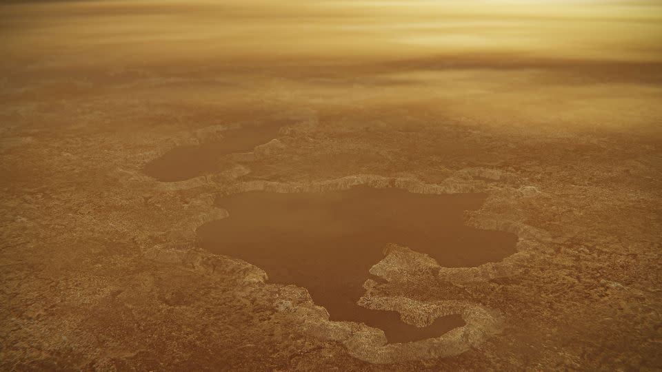 An artist's illustration shows a lake at the north pole of Saturn's moon Titan, including raised edges spied by Cassini.  - NASA/JPL-Caltech