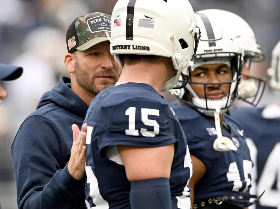 Penn State offensive coordinator Mike Yurcich talks to quarterback Drew Allar during warm ups for the game against Indiana on Saturday, Oct. 28, 2023.