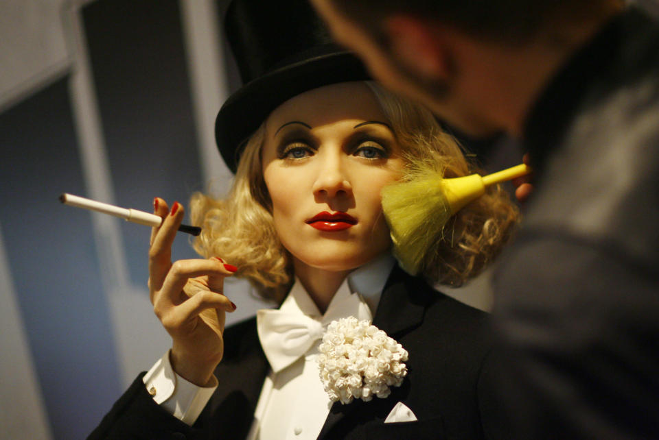 An artist brushes the face of wax figure of actress and singer Marlene Dietrich at the site of Madame Tussaud's Wax Museum in Berlin May 28, 2008. The new museum will open in July. REUTERS/Johannes Eisele